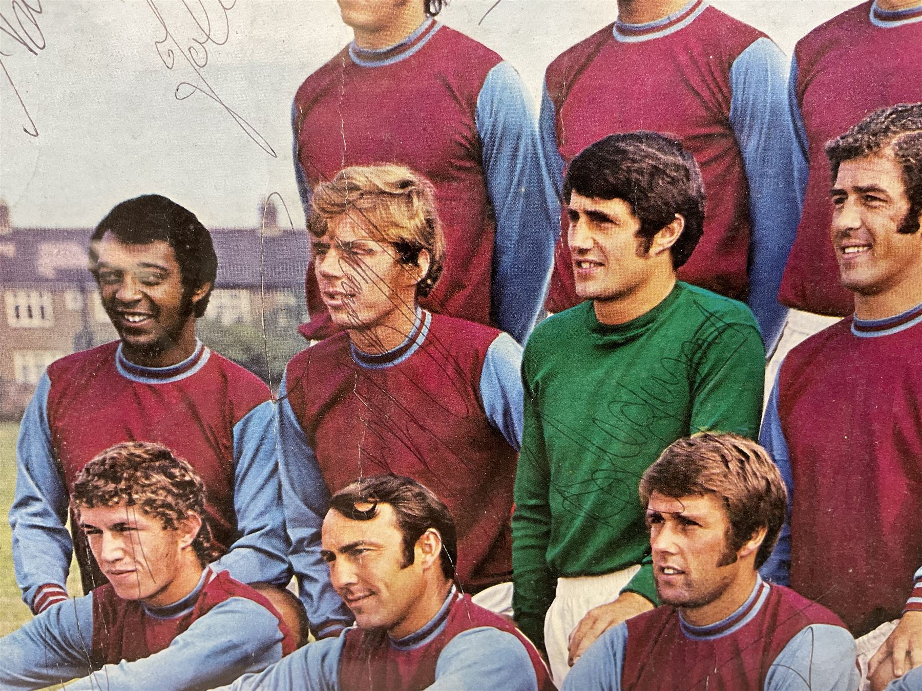 1970-1 photograph of West Ham United FC squad members, including Bobby Moore, Geoff Hurst, Harry Redknapp, Trevor Brooking, Jimmy Greaves, Billy Bonds etc, most players with signatures, 30 x 45cm, framed and glazed
