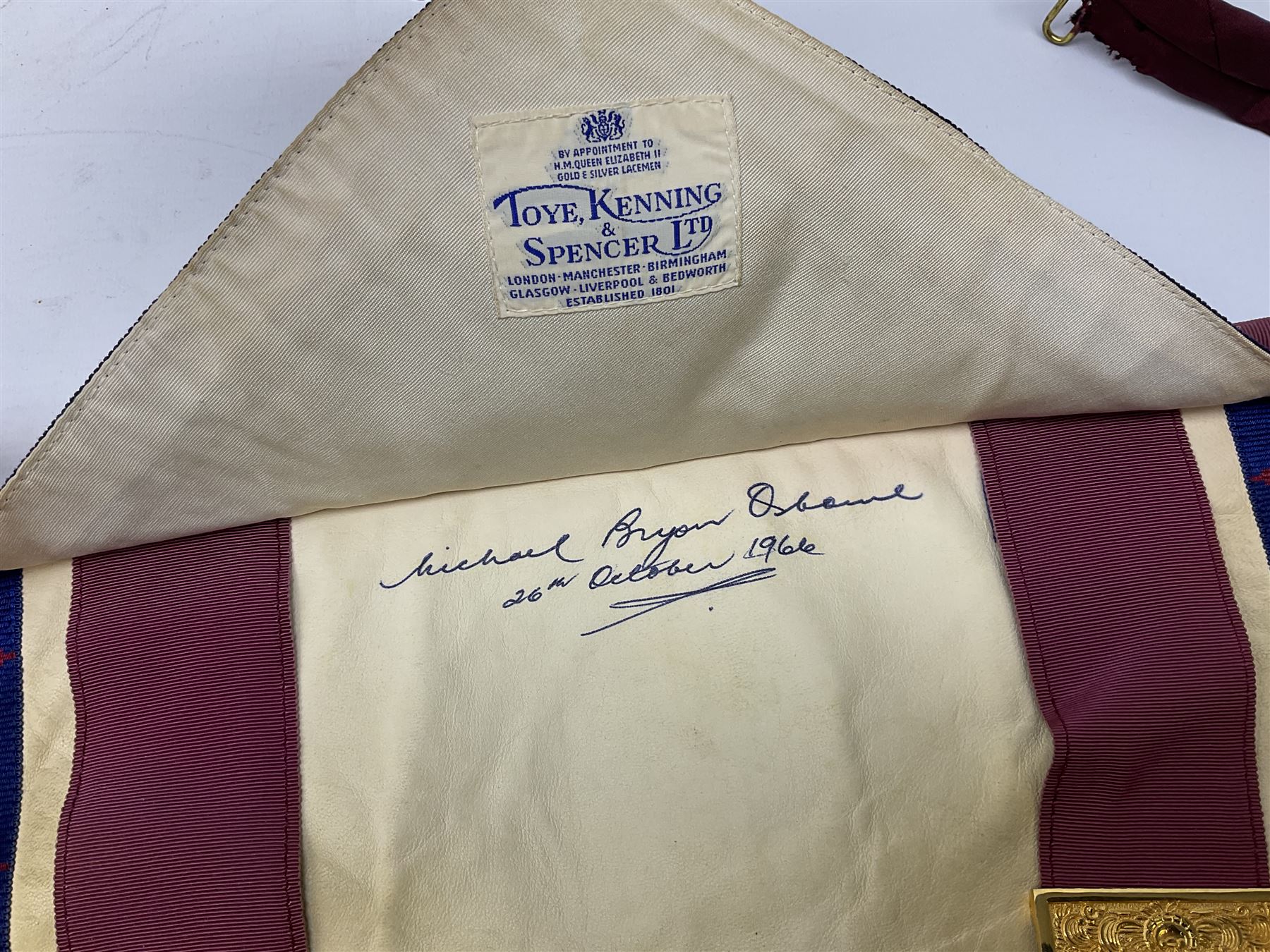 Two Masonic kid leather aprons, one with sash and cuffs, the other with sash, each marked 'Yorkshire North and East Ridings'; and three other unmarked Masonic aprons with sashes