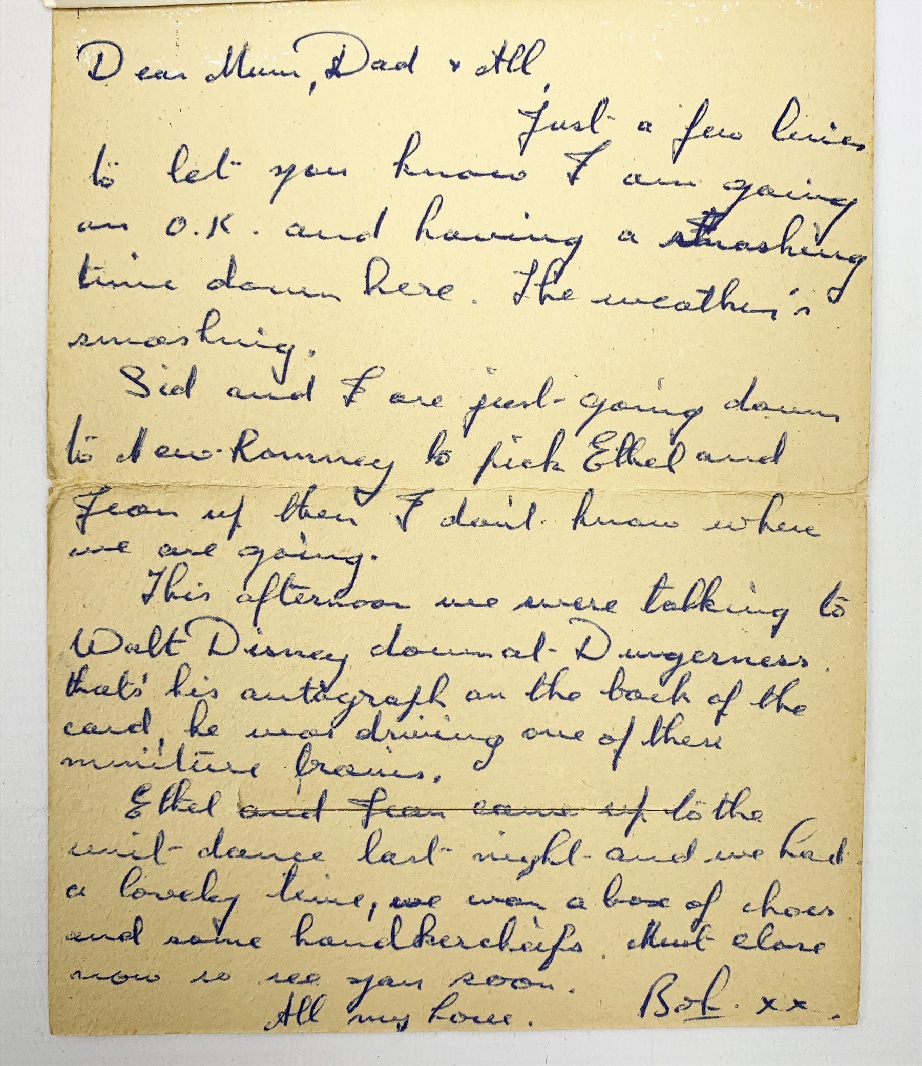 Walt Disney (1901-1966), American Animator, Academy Award Winner, signed letter card in blue ink, the envelope folding out to reveal six views in black and white of Romney, Hythe and Dymchurch Railway, and hand written letter detailed 'This afternoon we were talking to Walt Disney down at Dungeness, that's his autograph on the back of the card, he was driving one of the miniature trains.', post marked indistinct, dated 52. 