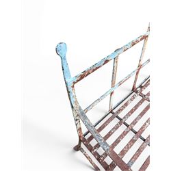 Regency period wrought iron strapwork garden bench, cresting rail with central Scottish thistle motif and flanking pediments, in distressed blue painted finish