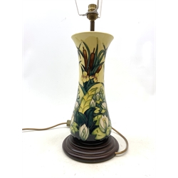  A large Moorcroft table lamp, decorated in the Lamia pattern, with bulrushes and water lilies, marks obscured by fixed stepped wooden base, including base and excluding shade H33.5cm.    