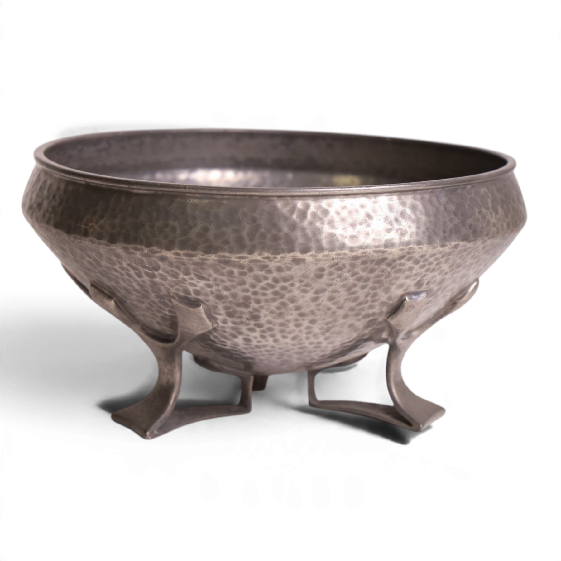 Oliver Baker for Liberty & Co - Tudric pewter bowl with hammered finish, upon three openwork feet, model number 01128 and makers marks stamped beneath, H10cm, D19cm