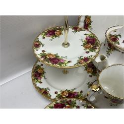 Royal Albert Old Country Roses pattern tea service for six, comprising teapot, sucrier, milk jug, dessert plates, one cake plate, one two tiered cake stand, salt and pepper pots and bud vase 