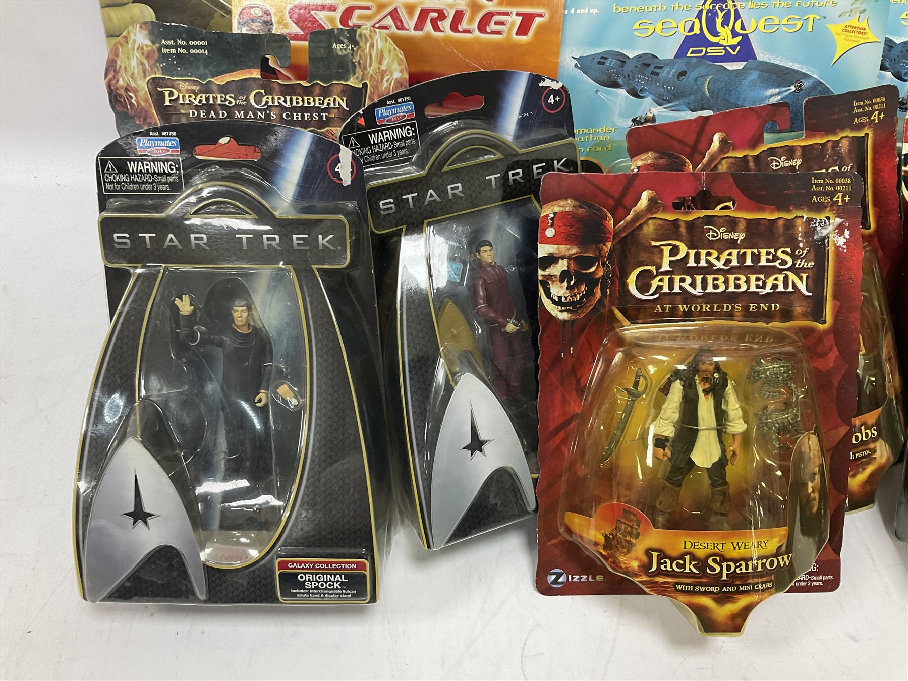 Seventeen TV & film related carded action figures comprising four Pirates of the Caribbean; five Shrek; three Star Trek; two Sea Quest DSV; Captain Scarlet, Warriors of Virtue; and Jurassic World; all in unopened blister packs (17)