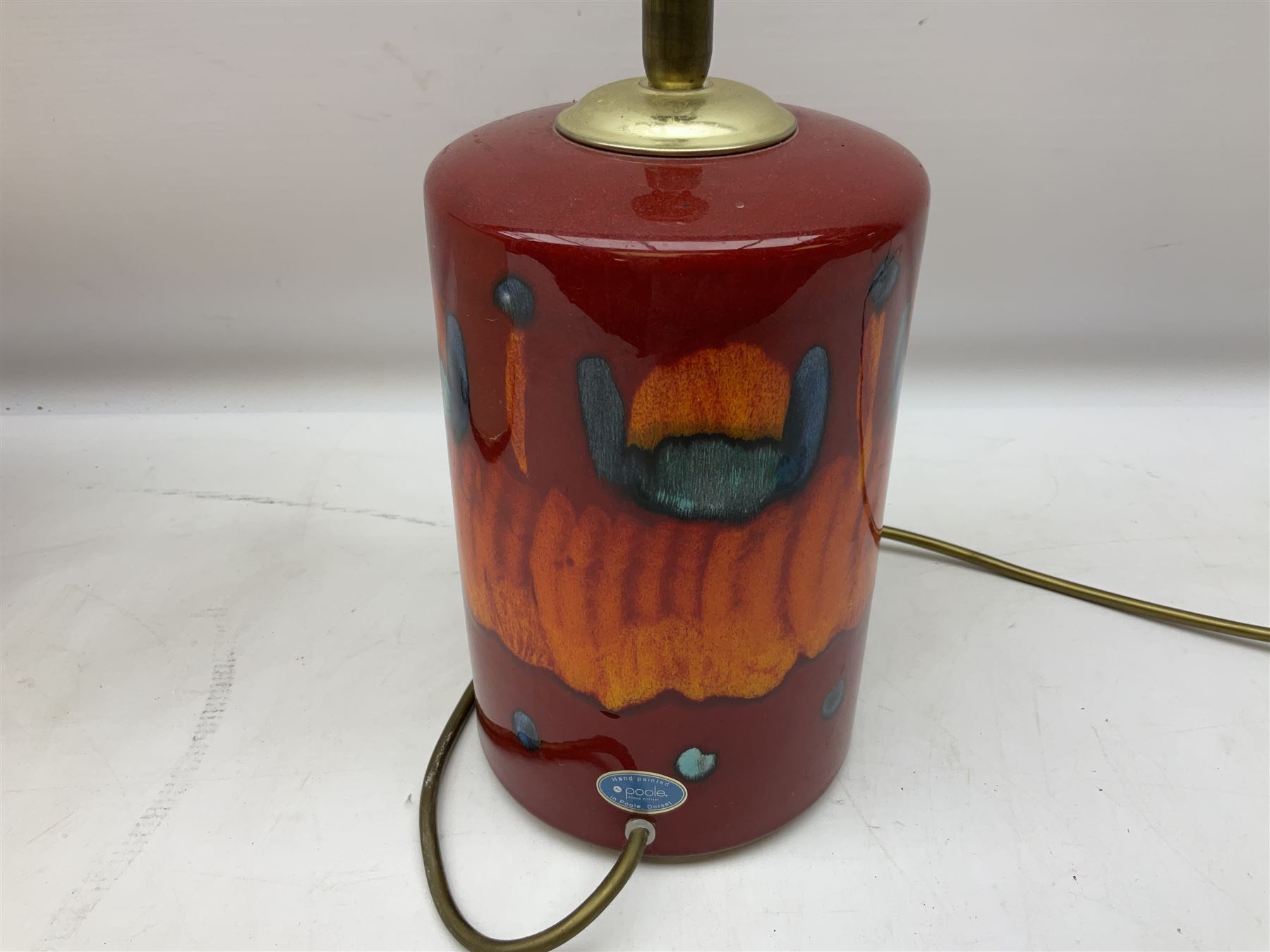 Poole Pottery table lamp in Volcano pattern of cylindrical form, with a cream lampshade, lamp H30cm