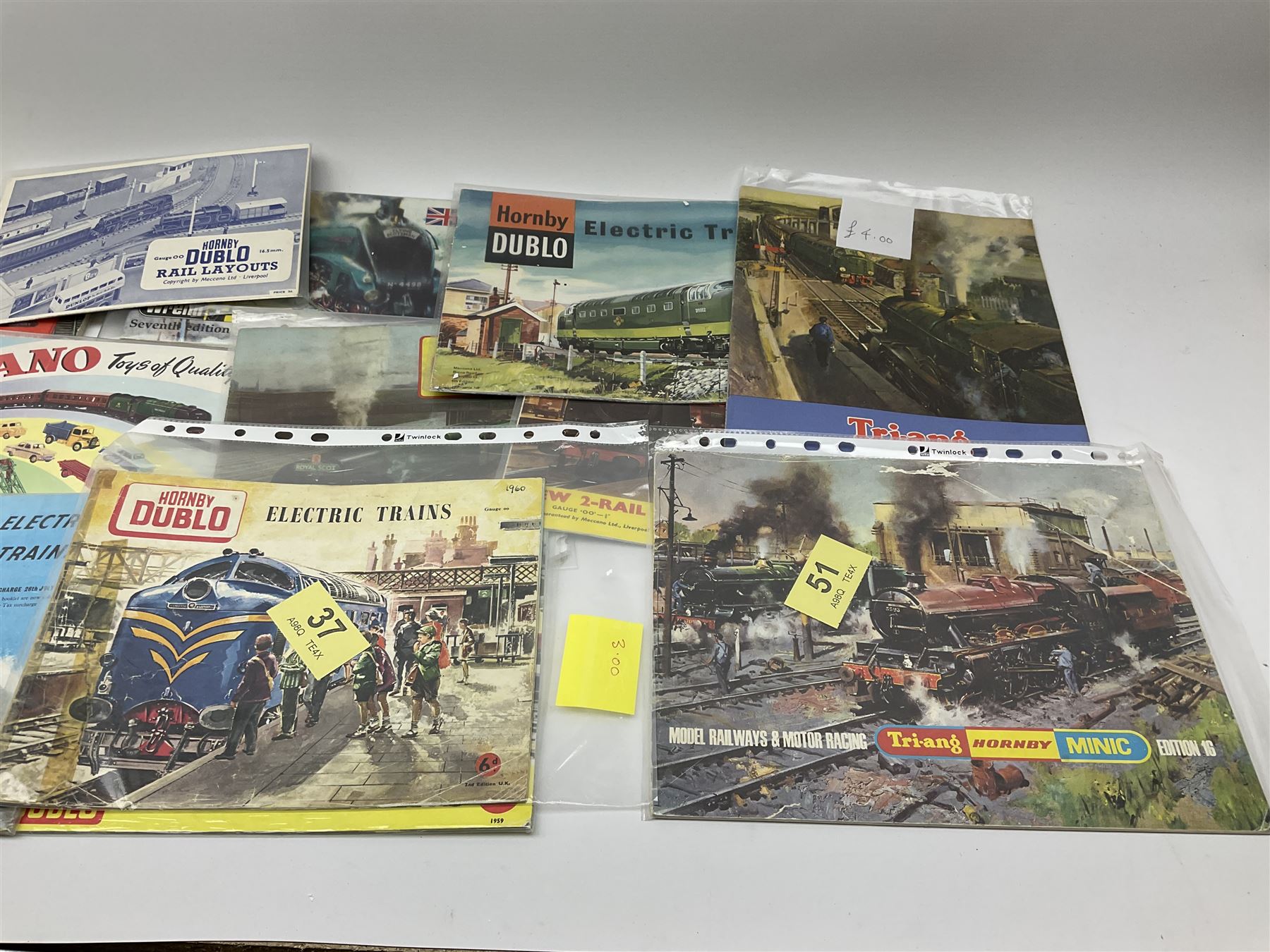 Hornby Dublo - three Electric Trains Catalogues 2nd - 4th editions 1960-62; Book of Trains 1959; New 2-Rail Leaflet 1960; Meccano Catalogue 1958; Rail Layouts booklet; three Tri-ang/Tri-ang Hornby catalogues 8th, 9th and 16th editions; Trix Twin Railway Permanent Way Manual 1953; and Wrenn catalogue 7th edition c1988.