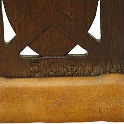 Mouseman - important oak monks chair, c1930s, the curved back inscribed with motto 'Cum Bona Voluntate Servientes' (serving with goodwill) over Trinity College Cambridge coat of arms, the shaped arms terminating with carved monks heads, each pierced side panel with Yorkshire Rose, tan leather seat on four octagonal legs joined by a cross stretcher, the back of the chair with initials ECH, with carved mouse signature, by Robert Thompson of Kilburn