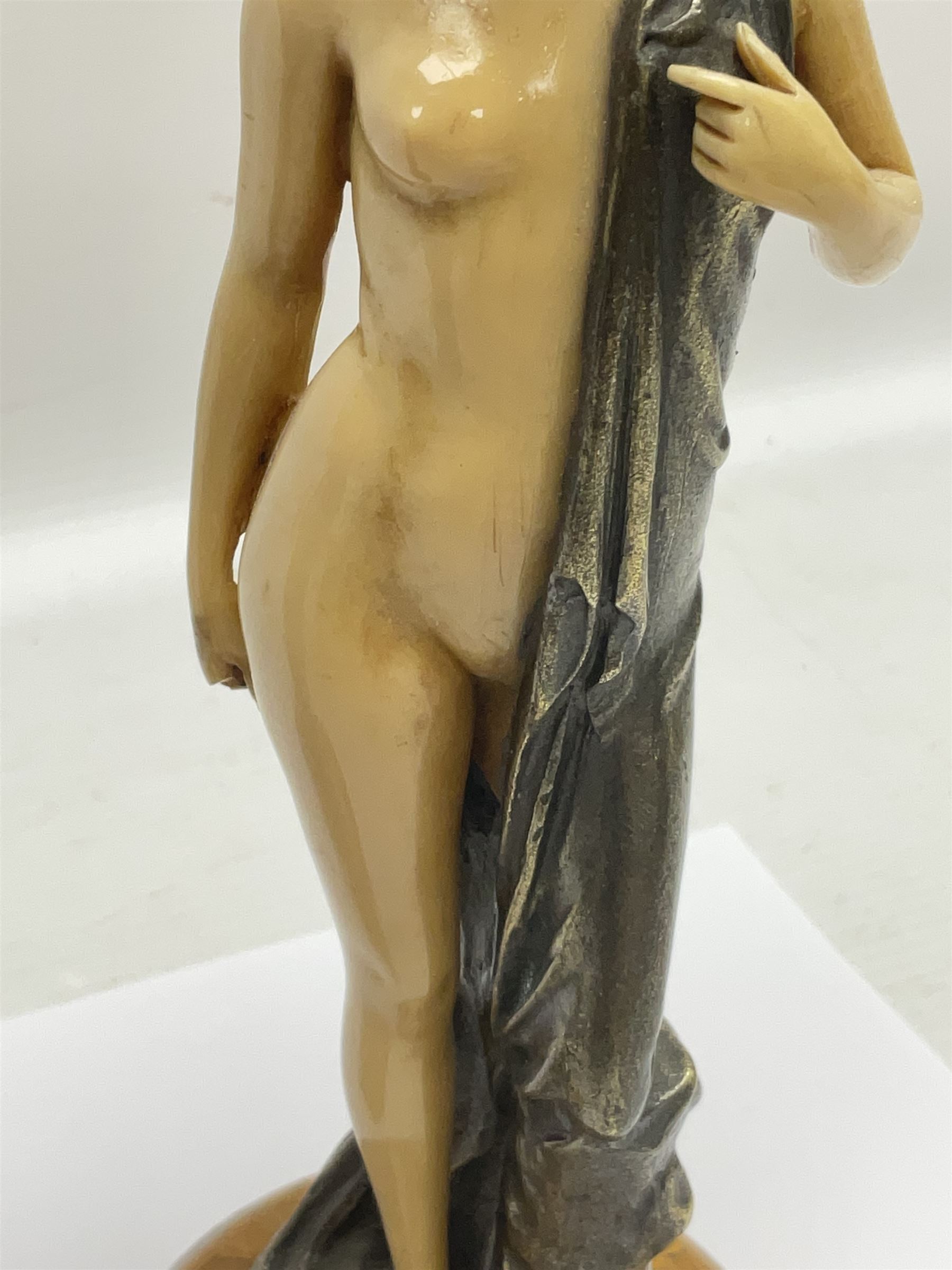 After Ferdinand Preiss (1882-1943), pair of Art Deco style, composite semi nude classical female figures, raised on circular onyx bases, H21cm