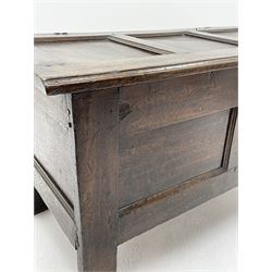 18th century oak blanket box, triple panelled hinged lid with moulded front edge enclosing candle box and small drawer, double panelled front, stile supports