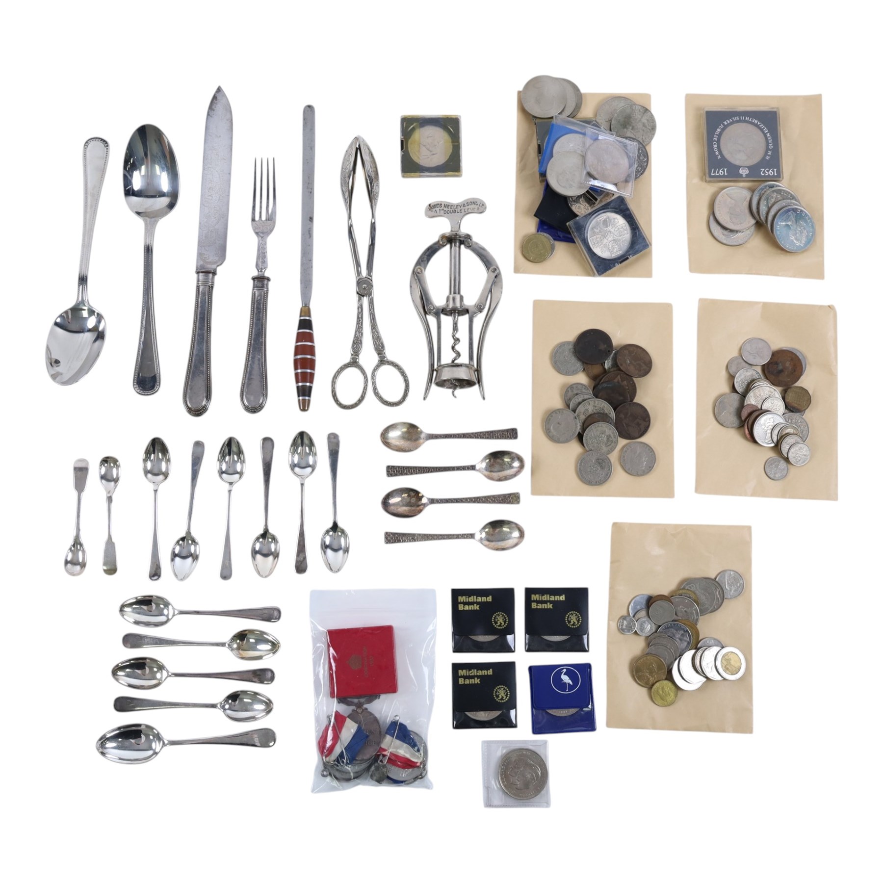 Collection of medals and coins, including Territorial Efficiency Medal, 1889 Amercian Morgan Silver Dollar, 1940 silver shilling, George IV coronation medal, Victorian and Edwardian pennies, commemorative coins etc and a quantity of silver plated cutlery