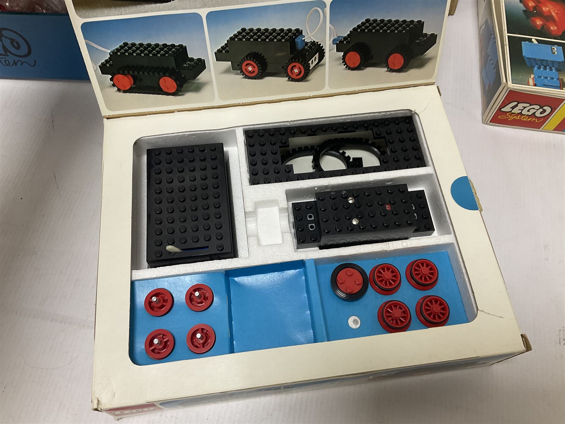 Fischer Technik/Lego/Playmobil - thirteen model building sets comprising eight Fischer Technik sets 50, 50/1, 50v, 50/2, 50+mot1 and two 50S, 50/1 add-on pack, with spare parts packs 01, 03, 05, two 22 and 30; two Lego sets comprising C107 and Lego Systems 103, part-set 870 and 970; Playmobil no.3520 set; four boxes of loose lego, various instruction manuals and a scrapbook 