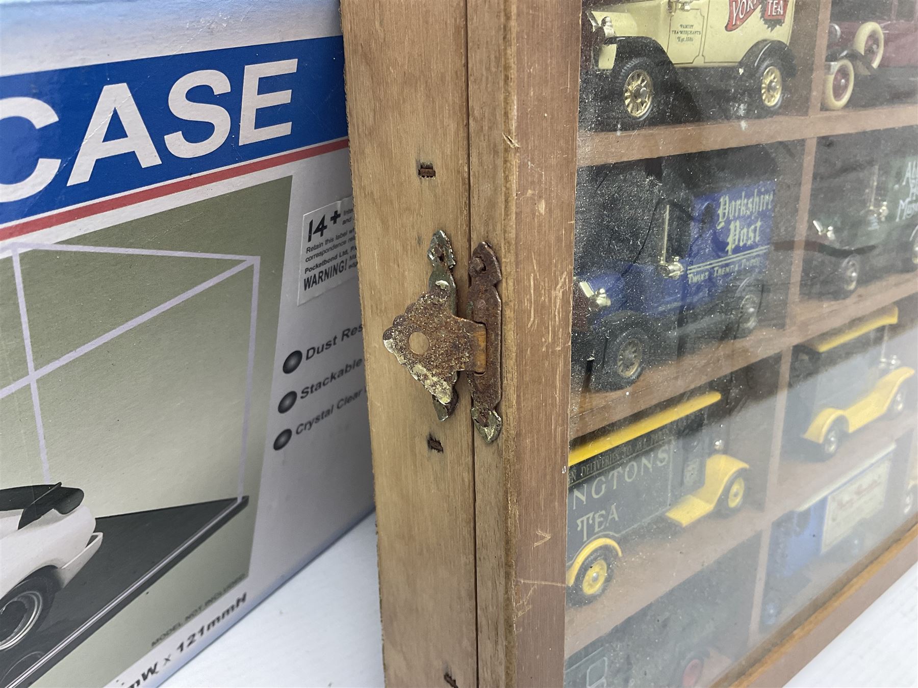 Franklin Mint 'The Classic Cars of the Fifties' collection with display rack, eleven (ex.12) die-cast models and folder of paperwork; another wall mounting display cabinet containing fifteen die-cast models; and an unused boxed Master Tools model display case