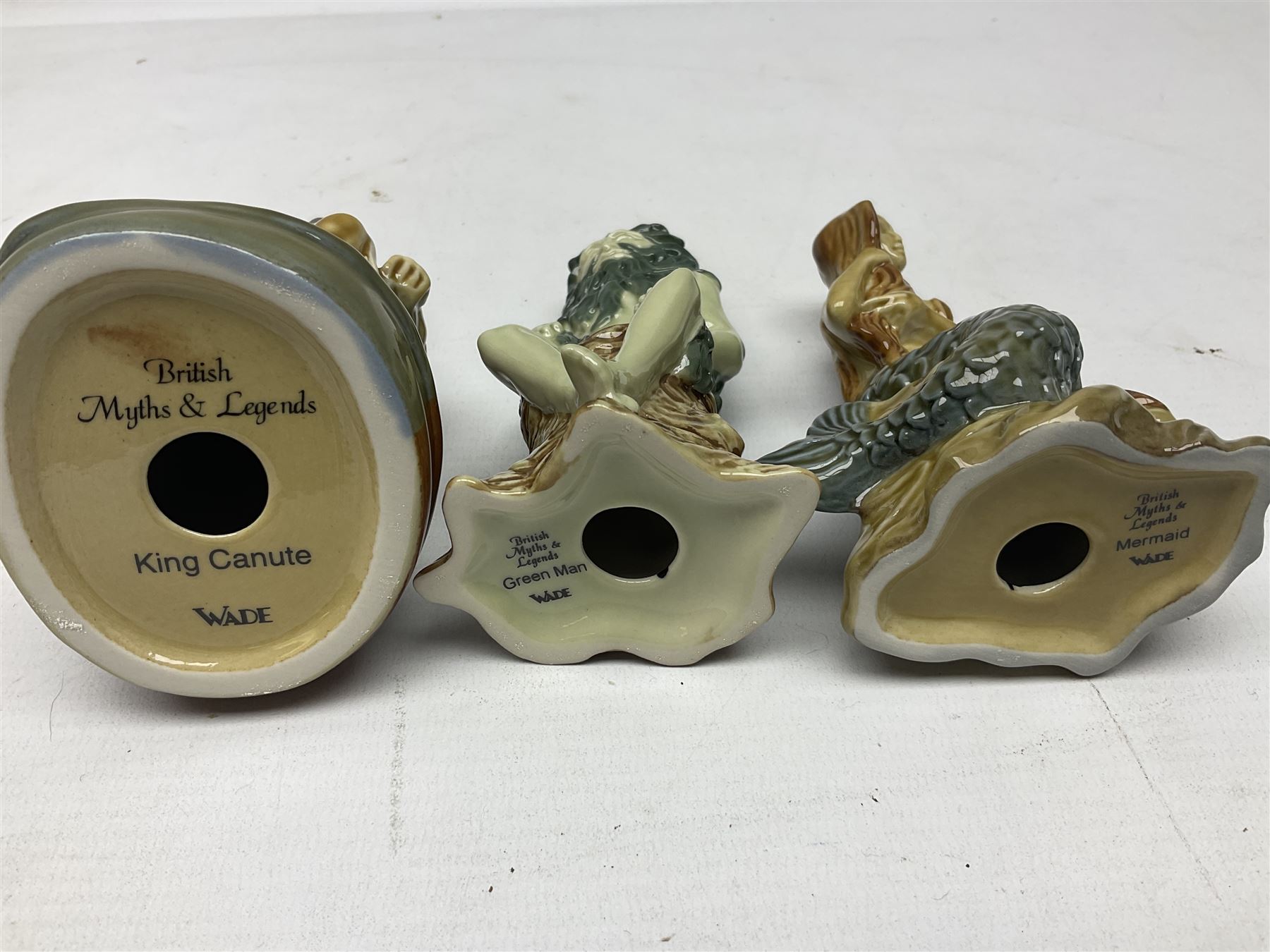 Nine Wade Collectables figures, comprising six Myths and Legends; King Canute, Mermaid, St George, Cornish Tin Mine Pixie, Puck and Green man, together with Lamb, Elephant and bear, a Wade Panda money box and two boxes of Wade Christmas Crackers