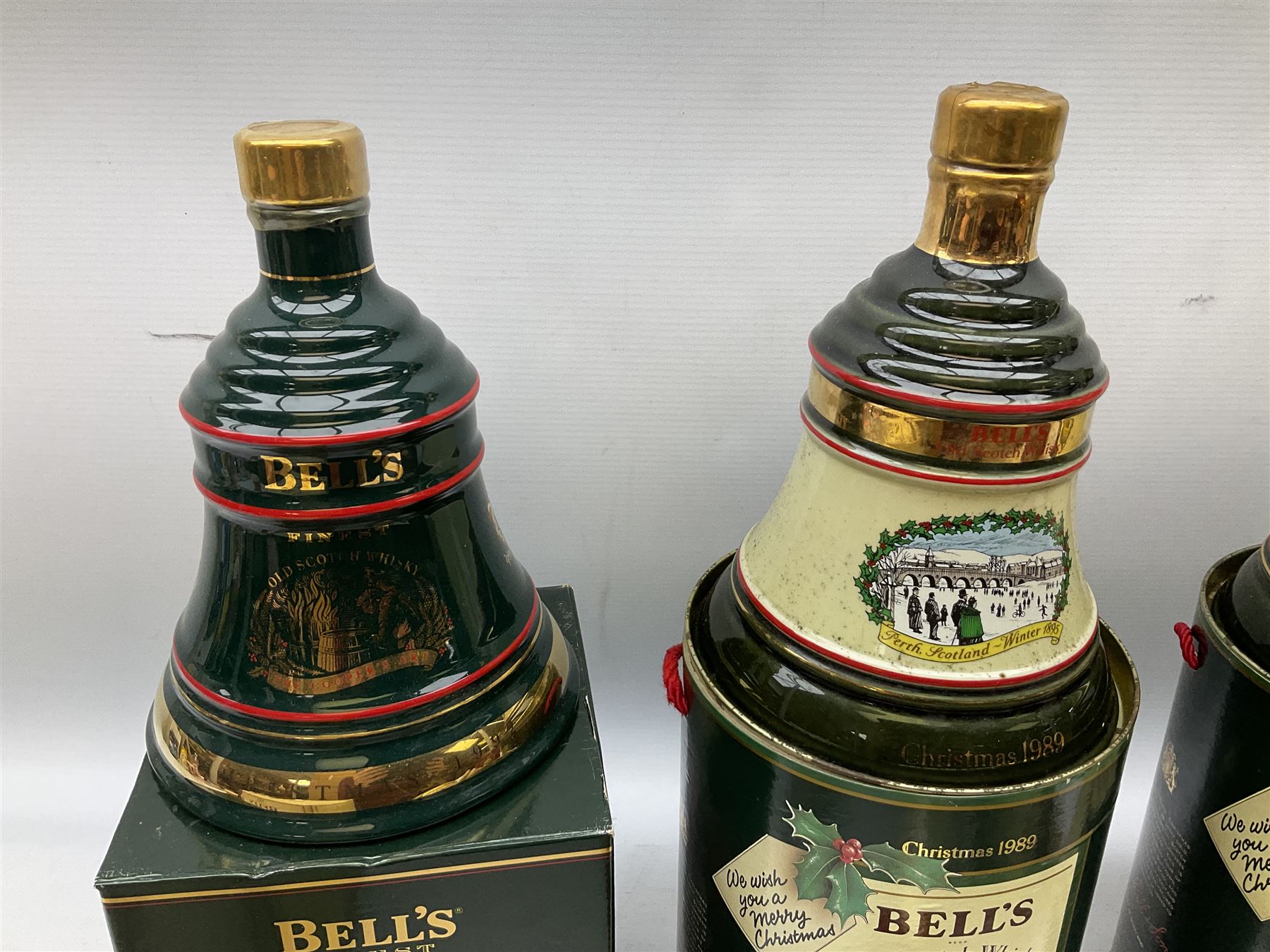 Six Bell's Old Scotch Whisky Christmas ceramic decanters comprising 1988, 1989, 1992, 1996, 1997 and 1998 all in original boxes and decanter seals intact 