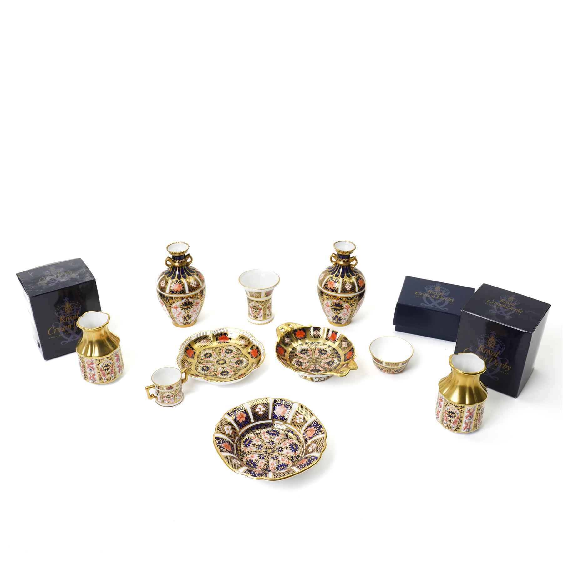 Mixed Royal Crown Derby Imari pattern 1128 wares, to include two Golden Primrose vases, both boxed, 8.5cm; five petal tray, boxed, D11.5cm, sweet tray, D13cm, miniature loving cup, boxed, and a miniature vase, H6cm etc (10)