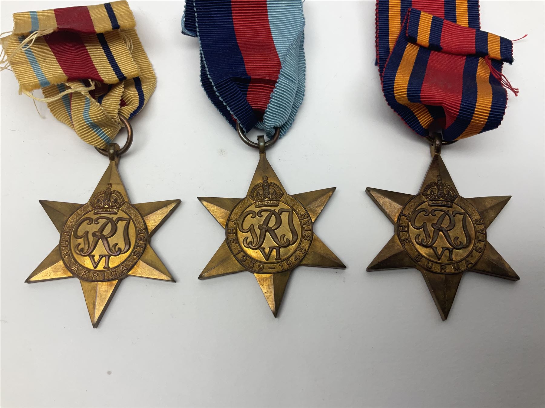 WW1 pair of medals comprising British war medal and Victory Medal awarded to 19774 Pte. G. Headlam Sea. Highrs.; another WW1 pair of medals comprising British War Medal and Mercantile Marine Medal awarded to Charles Filburn; WW2 group of five medals comprising 1939-45 War Medal, Defence Medal, 1939-45 Star, Africa Star and Burma Star; in issue box addressed to Mr. H, Smithson with medal slip; all with ribbons; and Edward VIII Coronation medal (10)