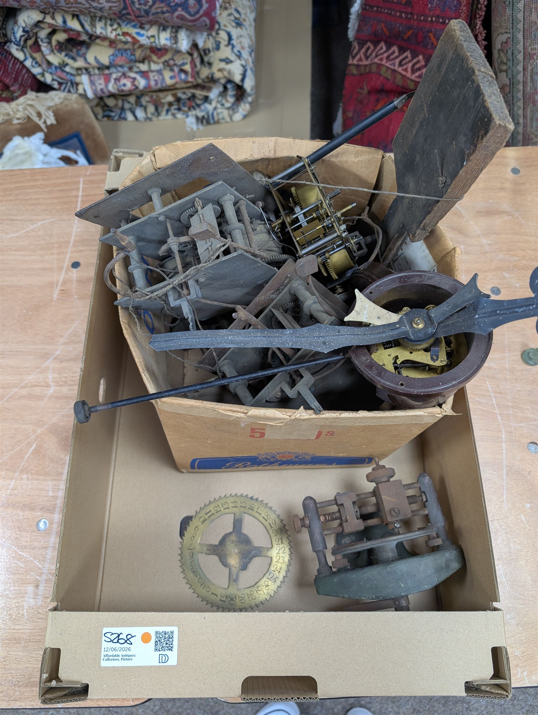 Collection of clock parts and accessories, including movement, faces, dials, tools, brass fittings, etc, in three boxes
