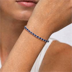 18ct white gold sapphire and diamond bracelet, twenty-six oval cut sapphires, each spaced by two round brilliant cut diamonds, stamped 750, total sapphire weight 10.60 carat, total diamond weight 0.46 carat