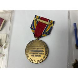 Nine American medals comprising Legion of Merit, Distinguished Flying Cross, Purple Heart named to Dick L. Sparman, Navy Good Conduct Medal, National Defence Service Medal, Army Commendation Medal, two WWII Victory Medals and China Medal; all with ribbons (9)