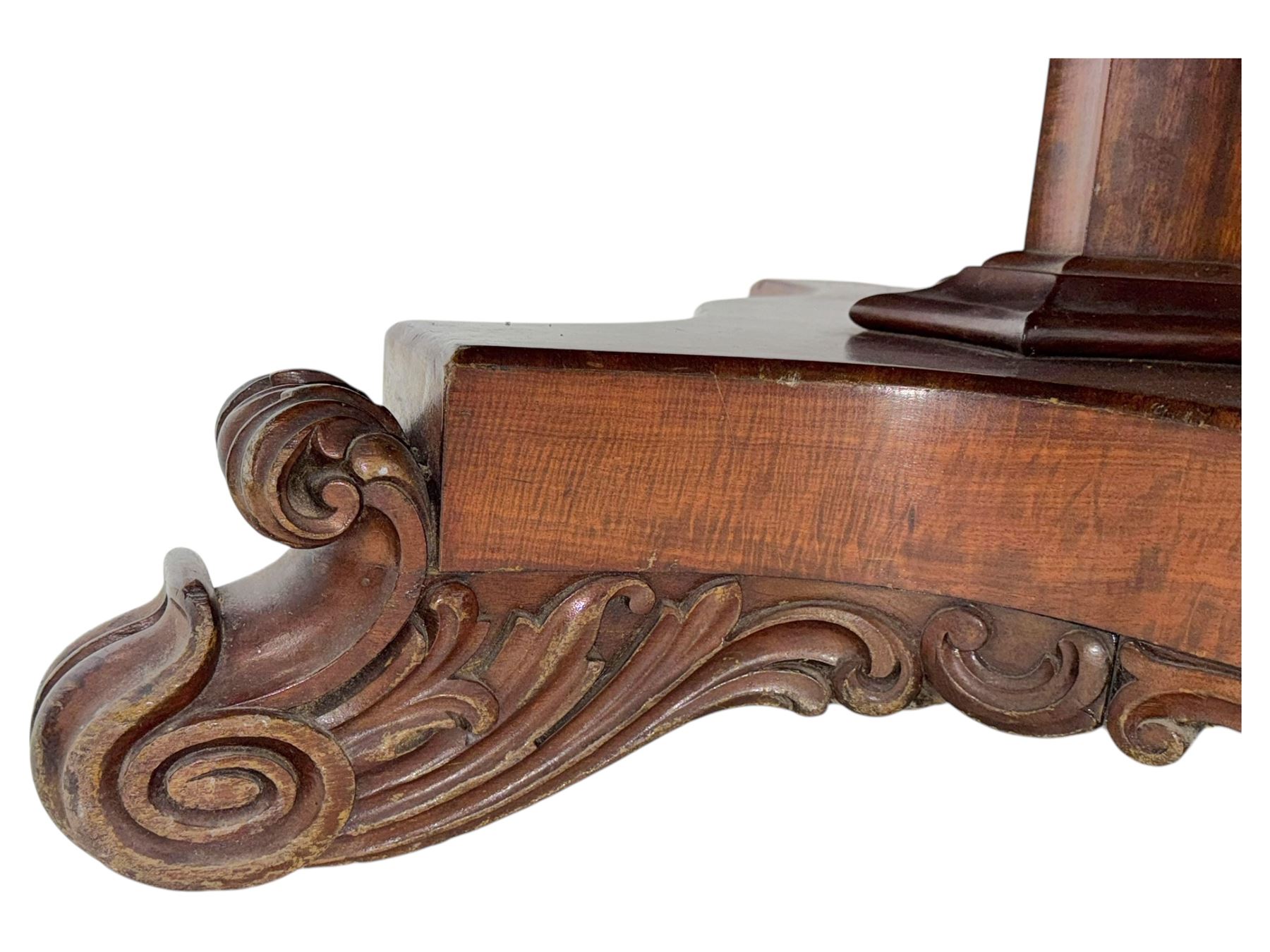 Victorian mahogany tilt-top table dining table, rounded tilt rectangular top with moulded edge, on octagonal column, raised on shaped quadriform base with bold scrolled feet