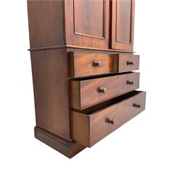 Victorian mahogany linen press, projecting moulded cornice, two doors with arched panels enclosed four linen slides, the lower section fitted with two short and two long drawers, on plinth base
