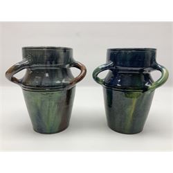 Pair of Art Nouveau style vases, probably Belgian, each with merging blue, brown and green decoration and three twisted handles, one impressed LSV beneath, H18.5cm