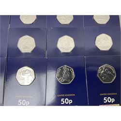 Mostly United Kingdom Queen Elizabeth II commemorative fifty pence coins, including 2019 'Gruffalo', 2020 'Iguanodon', 2022 'The Queen's Jubilee' etc, housed on cards, face value of UK coins approximately 20 GBP