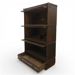 Globe Wernicke - early 20th century three sectional stacking library bookcase, two glazed sections above a panelled section, on a plinth base with inbuilt drawer