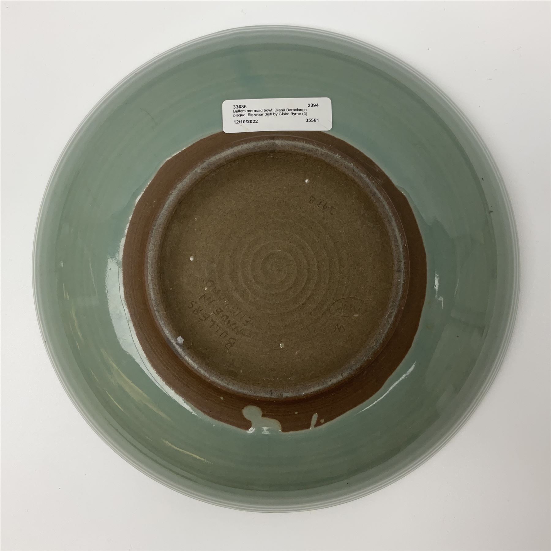 Agnete Hoy (1914-2000): Bullers studio pottery celadon glazed bowl, the interior with incised decoration depicting a Mermaid, D28.5cm