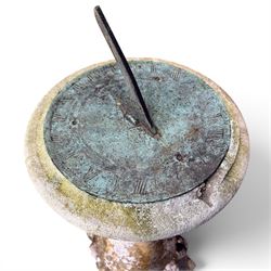 Large weathered cast stone sundial, raised on circular column of bulbous form, square plinth base