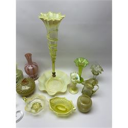 A group of Victorian and later Vaseline glass, to include part epergne, two vases with crimped rims and trailed decoration, a uranium glass vase, lemon Vaseline glass twin handled bowl, etc. 