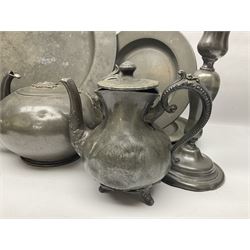 Large 18th/19th century pewter charger and a collection of other 18/19th century pewter, including pair of candlesticks, two teapots, a quantity of plates, chamberstick and mugs, charger D38cm