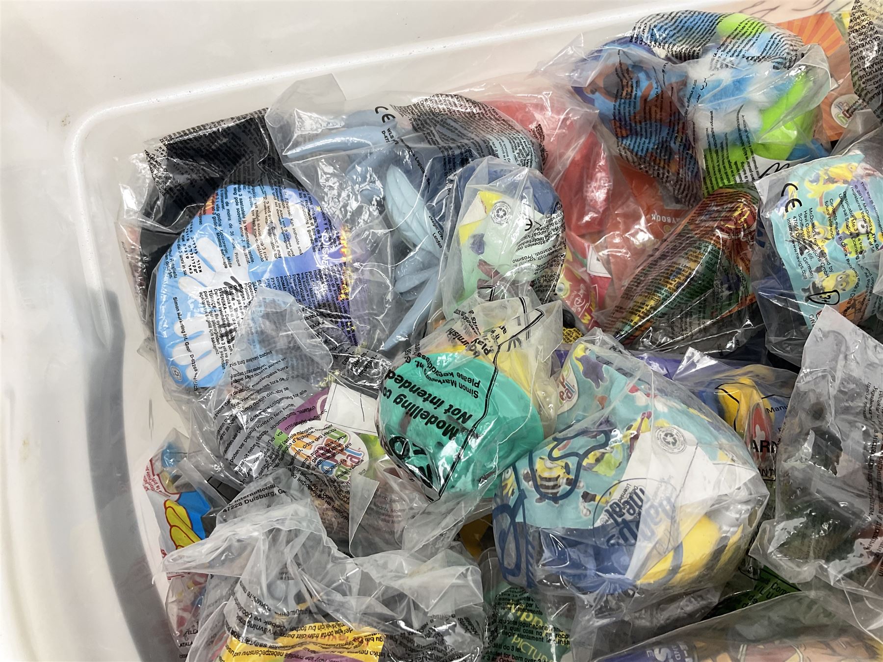 Quantity of Sunny Jim advertising soft toys, together with a quantity of Mcdonalds toys in two boxes