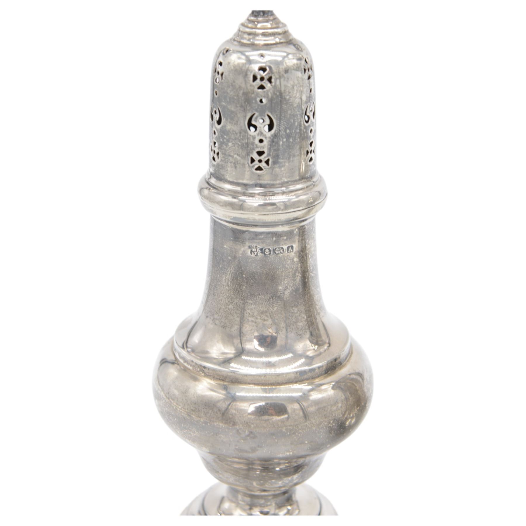 Two early 20th century silver sugar casters, the first an Edwardian example of faceted urn form, hallmarked Sibray, Hall & Co Ltd, London 1910, the second a 1920s example of typical urn form, upon a stepped circular filled base, hallmarked William Neale & Son Ltd, Birmingham 1925, tallest H20cm