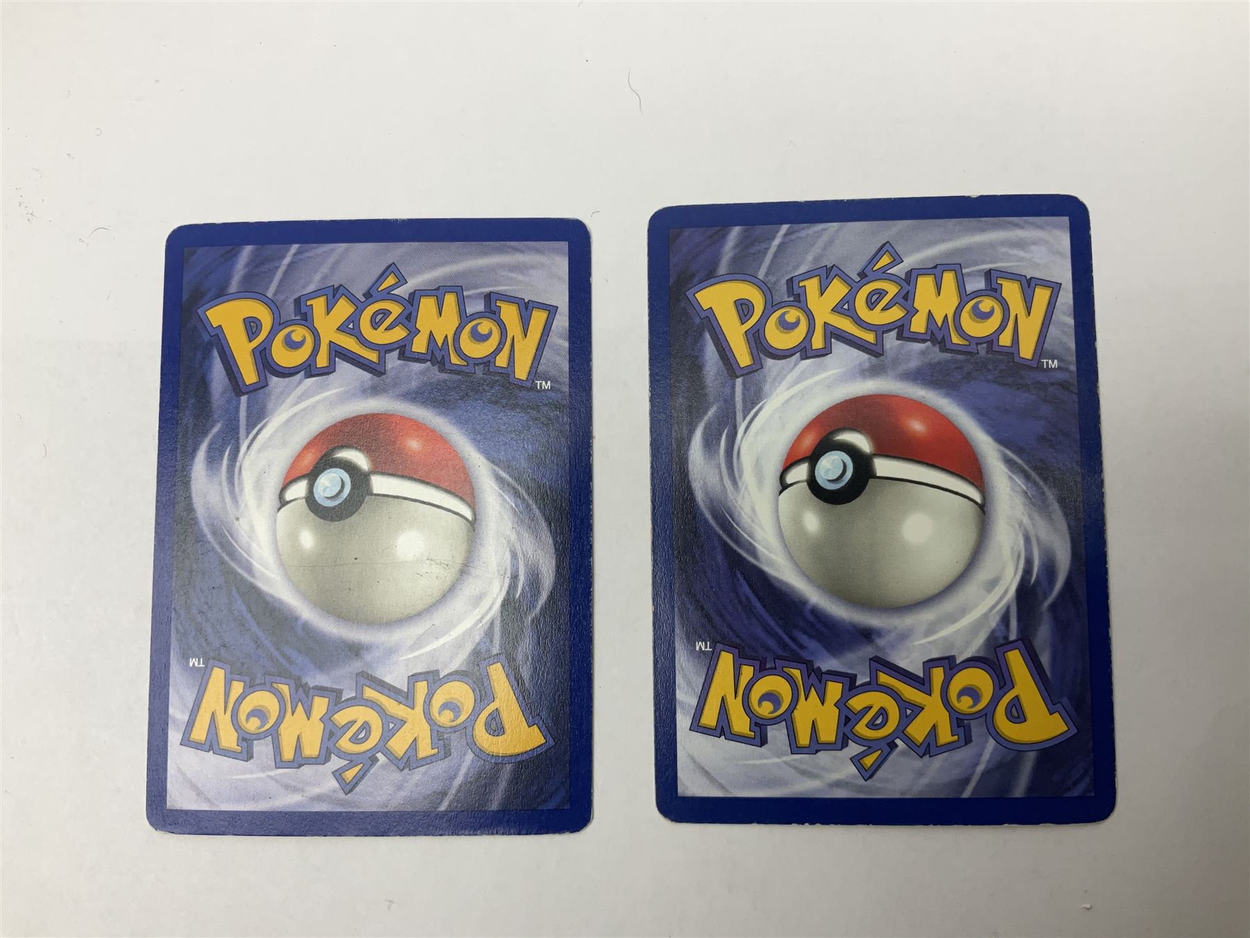 Collection of Pokemon trading cards, mostly 1999 Wizards Pokemon cards to include holo Charizard 4/102, first edition holo Machamp 8/102, further holographic cards; Dark Flareon 35/82 and Dark Vaporeon 45/82, cards from themed sets and 4th edition prints; 1998 Electronic Pokédex with cardboard boxes for themed decks Blackout, Overgrowth and Power Reserve Jungle, along with a large quantity of energy and trainer cards 