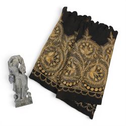 Stone carving of goddess, together with material with gold thread decorated with stylised flowers 