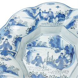 Early 18th century Frankfurt tin glazed earthenware shallow dish decorated in blue with panels of Chinese figures and landscapes D34cm