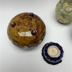 A group of Doulton Lambeth, to include a pair of Slaters Patent ewers with press moulded foliate decoration and yellow ground, H22cm, a jar of squat bulbous form decorated with white flowers upon a mottled brown ground, upon three nub feet, etc. 