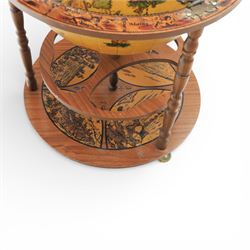 Late 20th century drinks globe, with lift off top with rotating inside with apertures for bottles, raised on brass castors