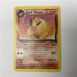 Collection of Pokemon trading cards, mostly 1999 Wizards Pokemon cards to include holo Charizard 4/102, first edition holo Machamp 8/102, further holographic cards; Dark Flareon 35/82 and Dark Vaporeon 45/82, cards from themed sets and 4th edition prints; 1998 Electronic Pokédex with cardboard boxes for themed decks Blackout, Overgrowth and Power Reserve Jungle, along with a large quantity of energy and trainer cards 