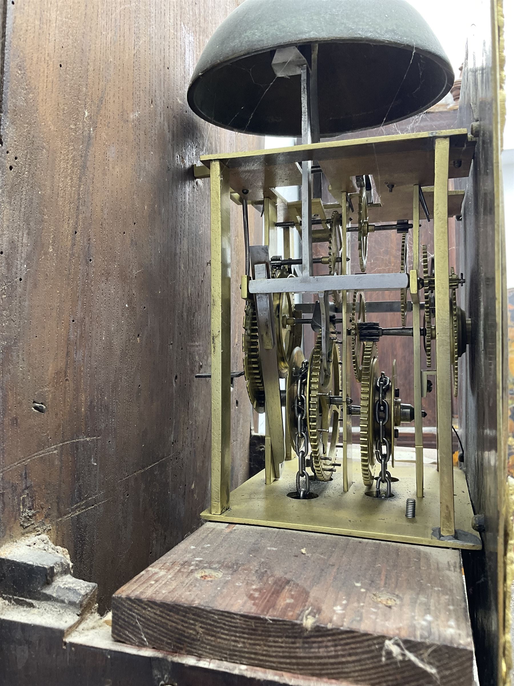 John Kemp of Yoxford (Suffolk) - 18th century oak 30 hour longcase clock c1770, with a later box top and finials, square hood door with attached pilasters and gesso capitals, long flat topped trunk door with a rectangular plinth and bracket feet, brass dial with cast spandrels and engraved dial centre, silvered chapter ring with Roman numerals and five minute Arabic's, with matching steel hands, birdcage chain driven movement with a recoil anchor escapement and count wheel striking. With weight and pendulum.
