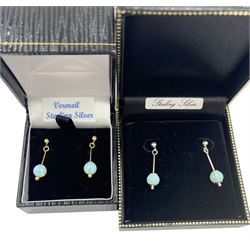 Pair of silver-gilt opal pendant earrings, together with a similar pair of silver opal pendant earrings, both boxed 