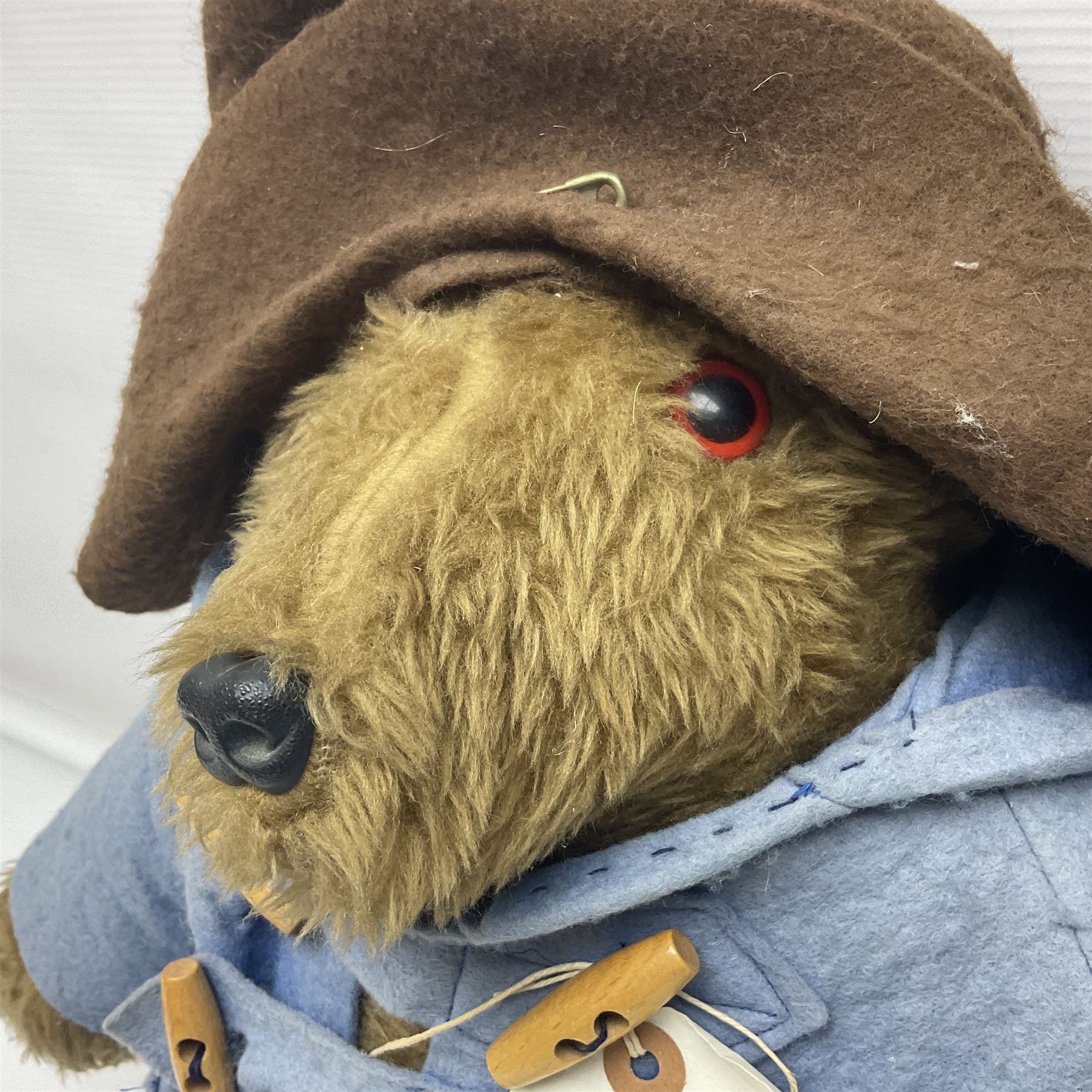 Paddington Bear with plush covered body, brown felt hat, pale blue duffle coat and blue wellingtons H54cm

