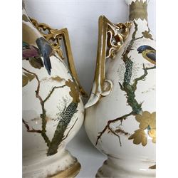 Pair of Franz Mehlem Bonn vases, the twin handled bodies painted with birds amongst blossom branches with a sun, detailed with gilt, H30cm