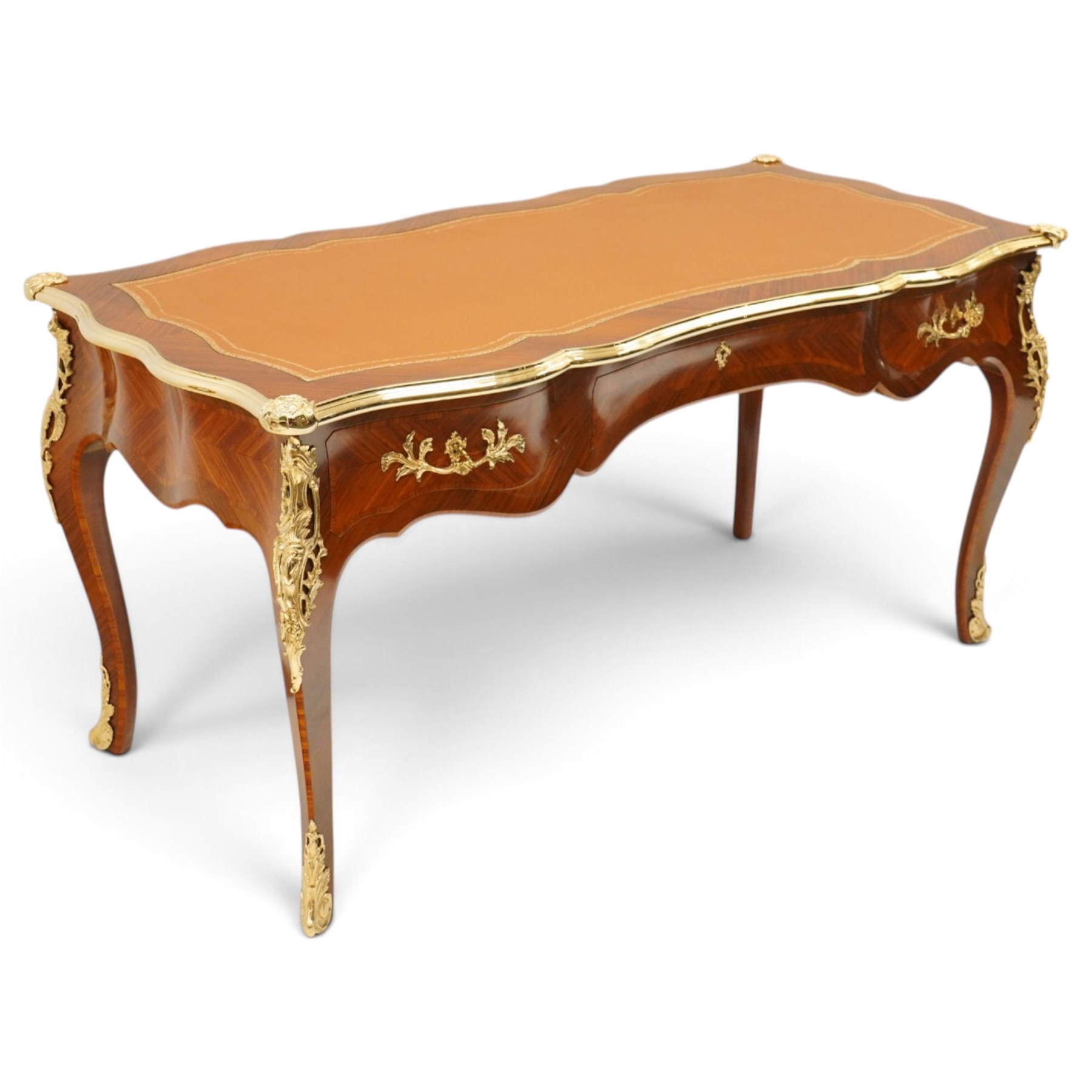 Baggio Anciens Meubles - Italian Louis XV style kingwood and gilt metal mounted bureau plat or writing desk, the shaped rectangular top with inset leather writing surface with gilt metal edge, above three shaped frieze drawers with gilt metal handles, raised on cabriole supports with gilt cartouche mounts to the knees and scroll feet