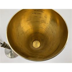 Pair of modern silver goblets by Stuart Devlin, the tapering cylindrical bowls each with spot hammered decoration and gilt interiors, the parcel gilt stems with signature textured detailing and six graduating knops, upon conforming spreading circular foot, hallmarked Stuart Devlin, London 1976, H17.7cm