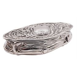 Art nouveau silver dressing table box, of shaped oval form, the sides repousse decorated with interlaced tendrils, the hinged cover with monogramed panel to centre within a foliate surround, hallmarked Birmingham 1906, maker's mark worn and indistinct, L13cm, approximate weight 2.67 ozt (82.9 grams)