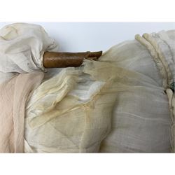 Victorian wax shoulder head doll with pale complexion, applied hair, inset glass eyes and fabric covered jointed body with kid leather lower arms; white linen dress and undergarments H50cm