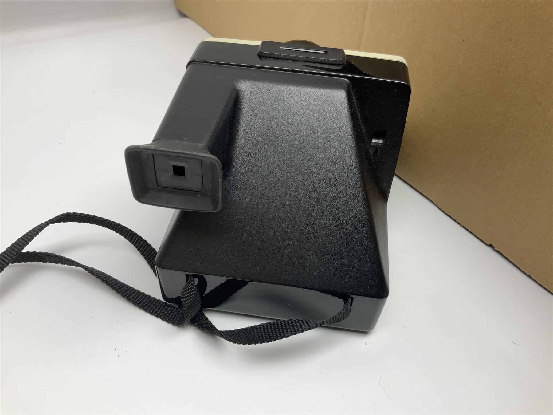 Johnson Bros Indies pattern tea and dinner wares, painted metal female bust on wooden plinth, three radios including one Roberts, Zenit B camera body, Polaroid 1000 land camera, Lorus wristwatch, and other ceramics etc, in four boxes