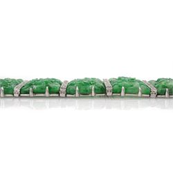 Art Deco platinum and white gold jadeite and diamond bracelet, twelve carved foliate jadeite panels, separated by a row of milgrain set old cut diamonds